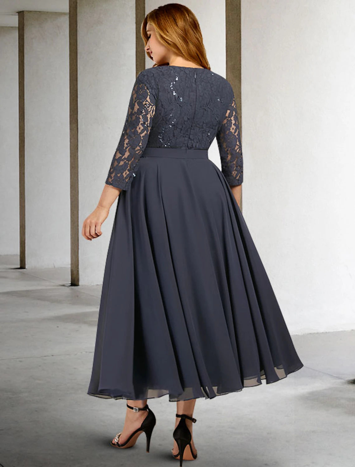 Back view of the elegant A-line dress, highlighting the flowing chiffon fabric.