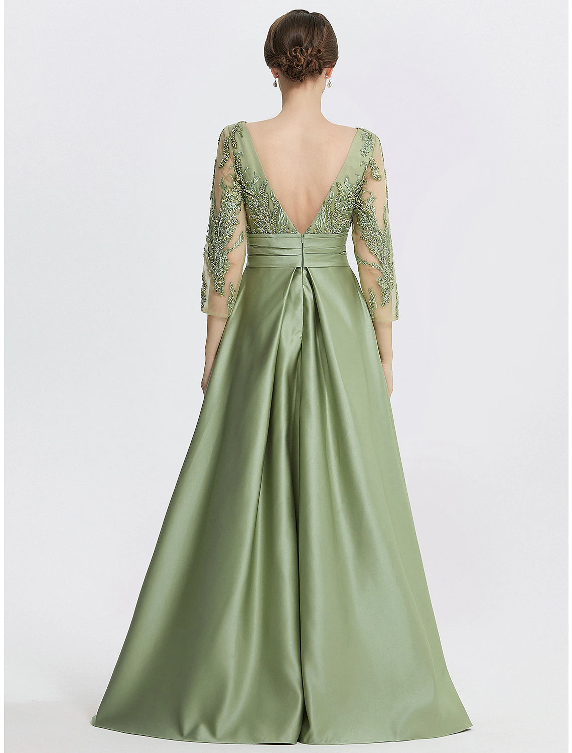 Side view of the A-line evening gown, highlighting the flowing satin fabric and slit.