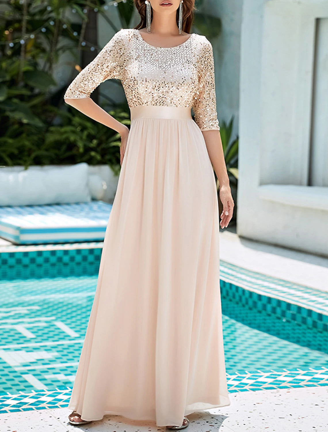 Close-up of the sequined tulle fabric on an elegant formal dress.