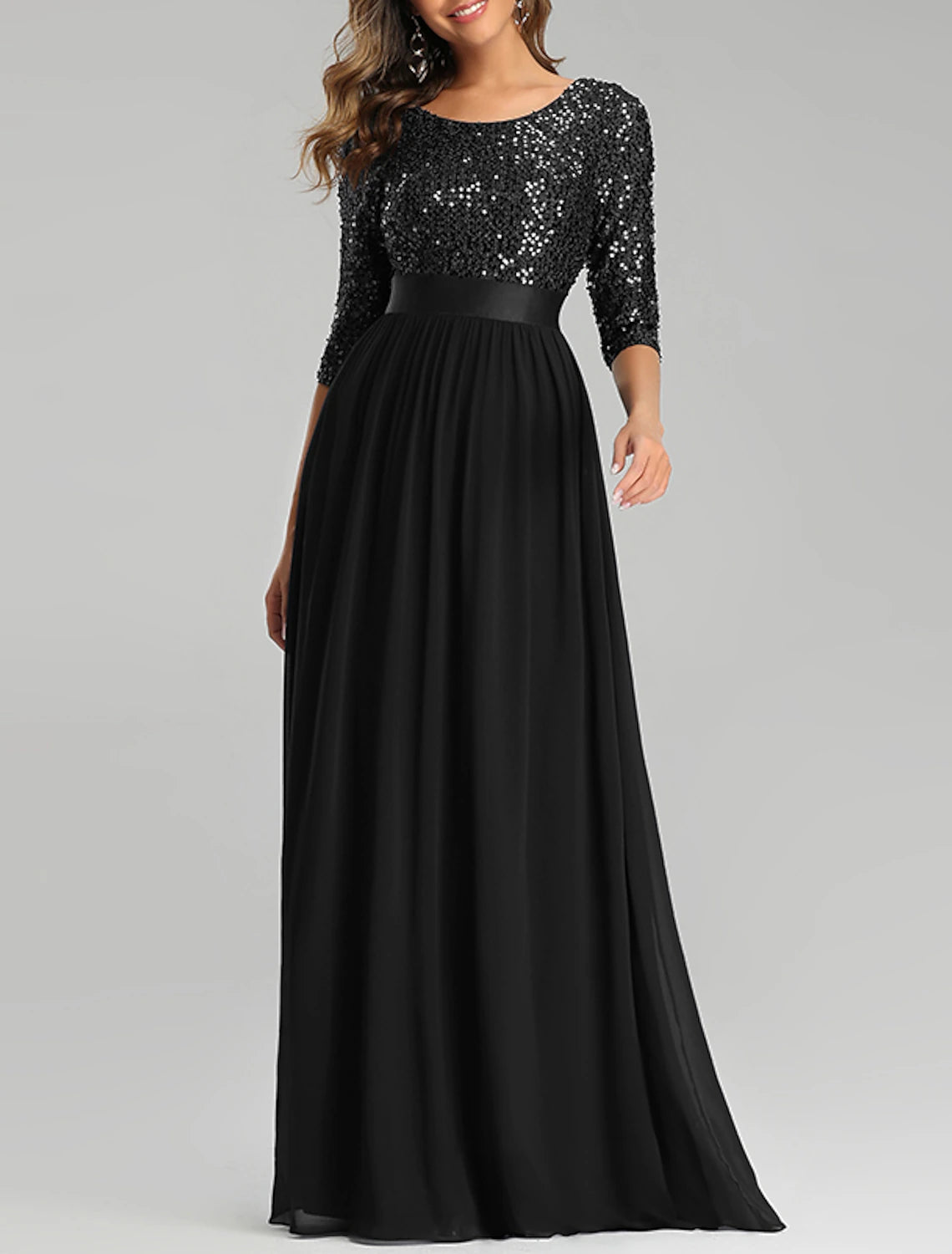 Side view of a woman wearing a plus size A-line sequined dress.
