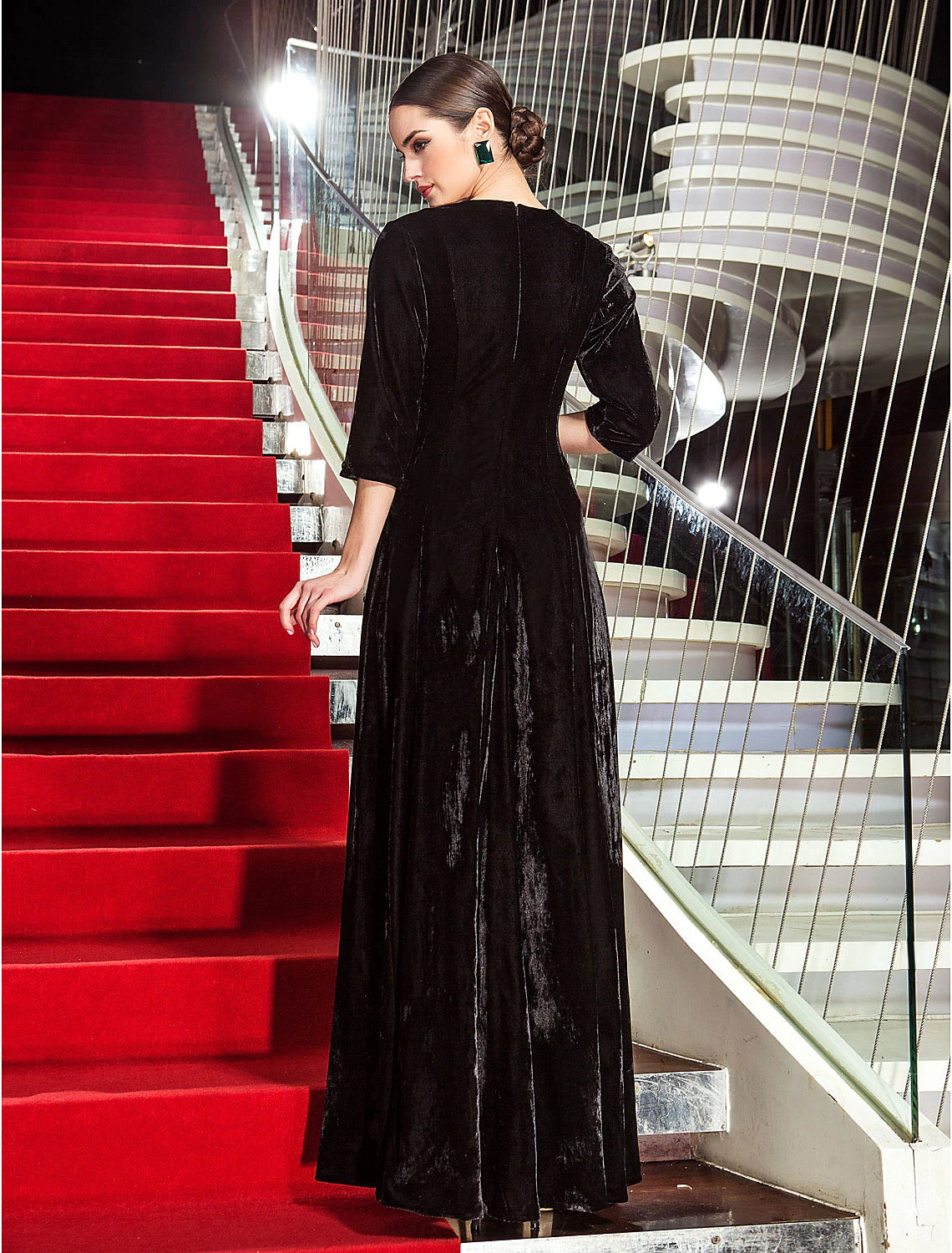 Back view of A-Line black velvet formal dress.