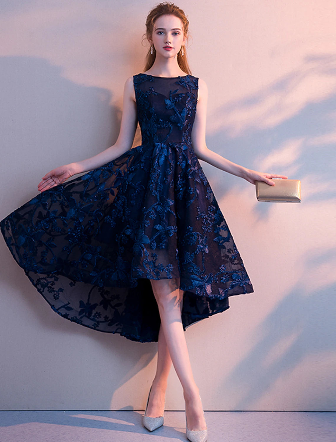 Model posing in the A-line jewel neck asymmetrical pleated tulle cocktail dress.