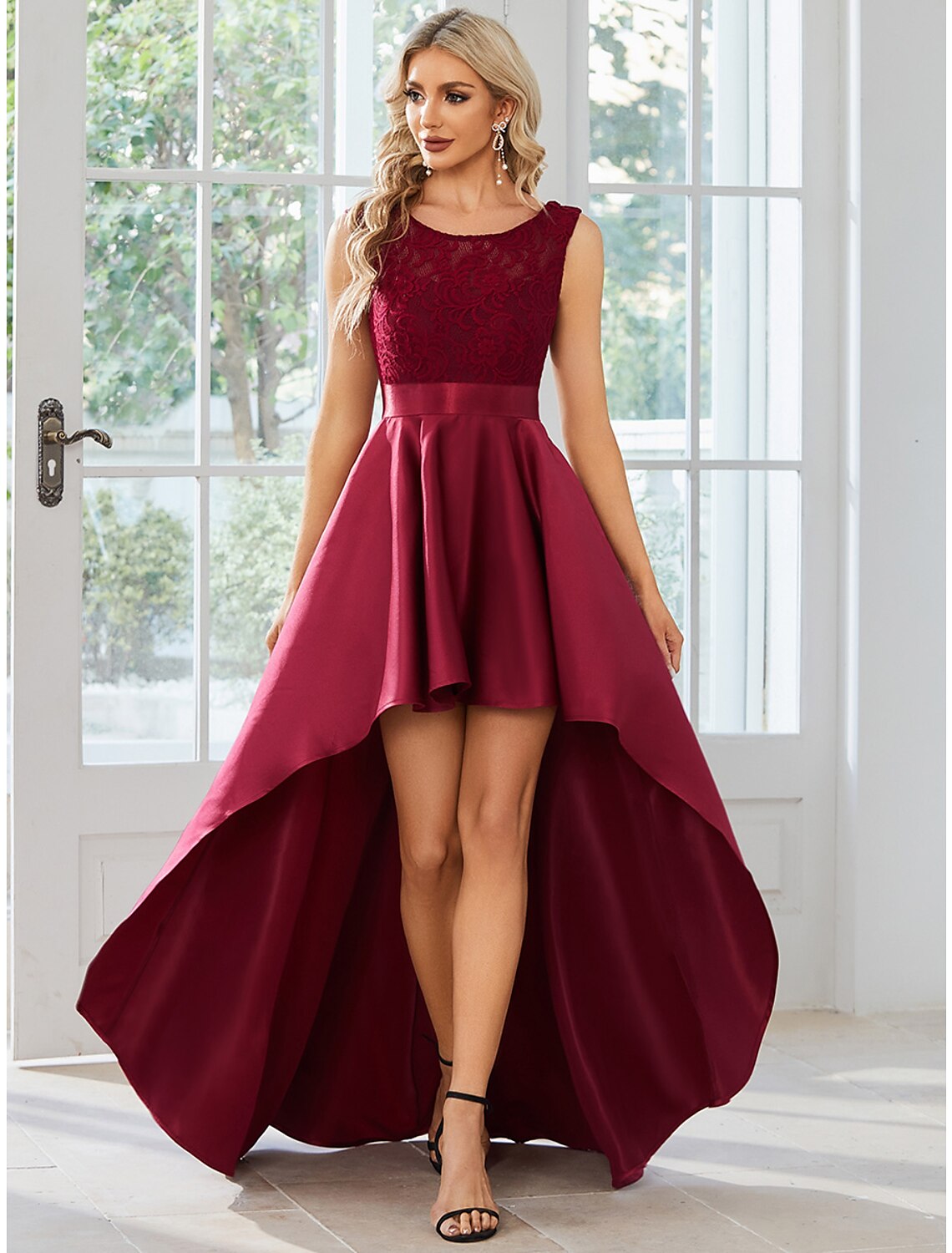 Elegant A-line satin dress with jewel neck and asymmetrical hem.