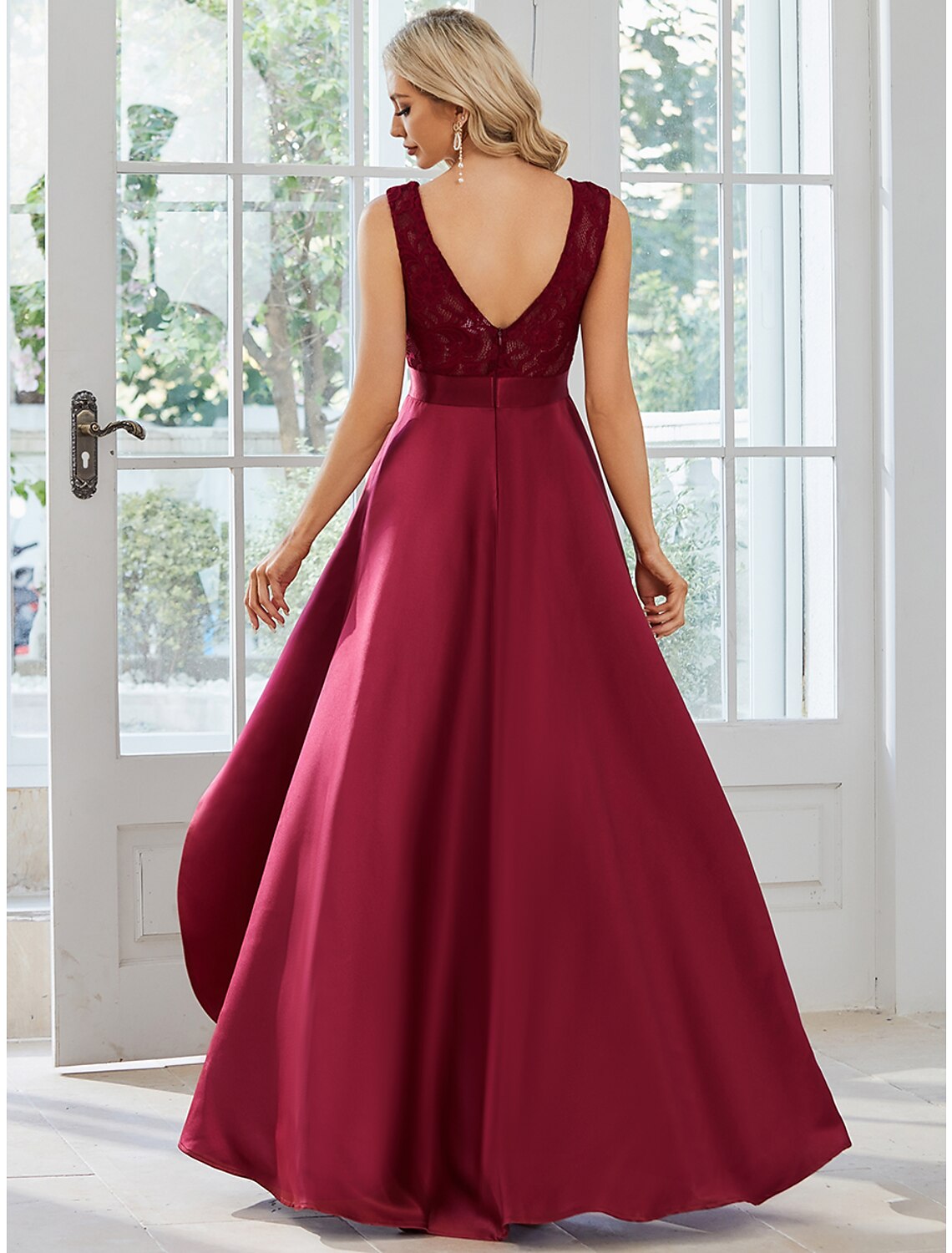 Close-up of the luxurious satin fabric and jewel neckline.