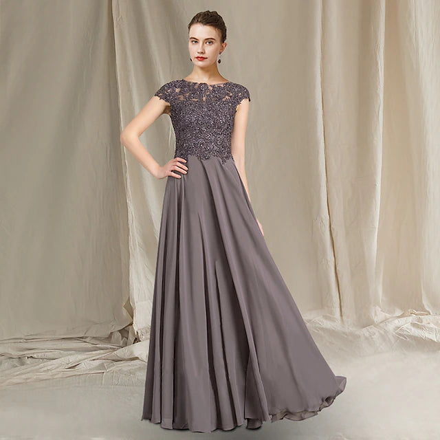 Elegant A-line mother of the bride dress with jewel neck and cap sleeves.