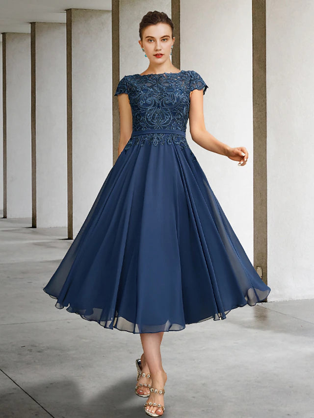 Elegant A-Line Mother of the Bride dress with jewel neck and cap sleeves.