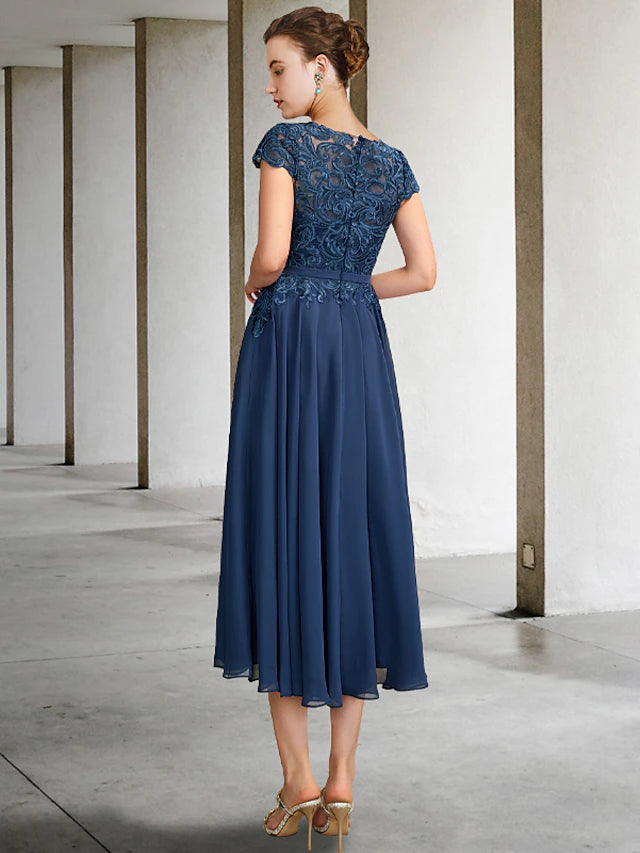 Luxurious A-Line gown featuring delicate lace appliques.