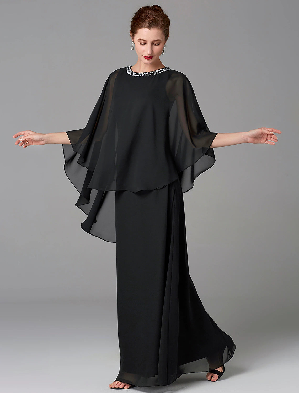 Full view of the elegant A-line chiffon cape dress with jewel neck and beading.