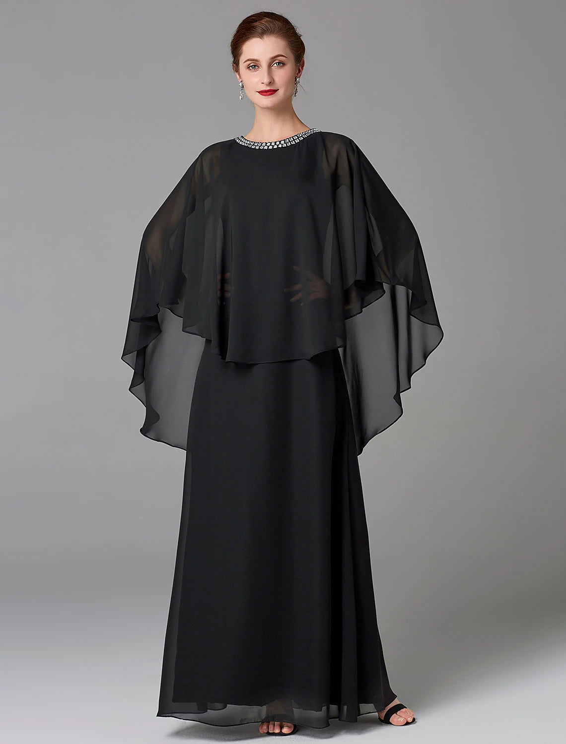 Back view of the floor-length chiffon dress, showing the elegant drape.