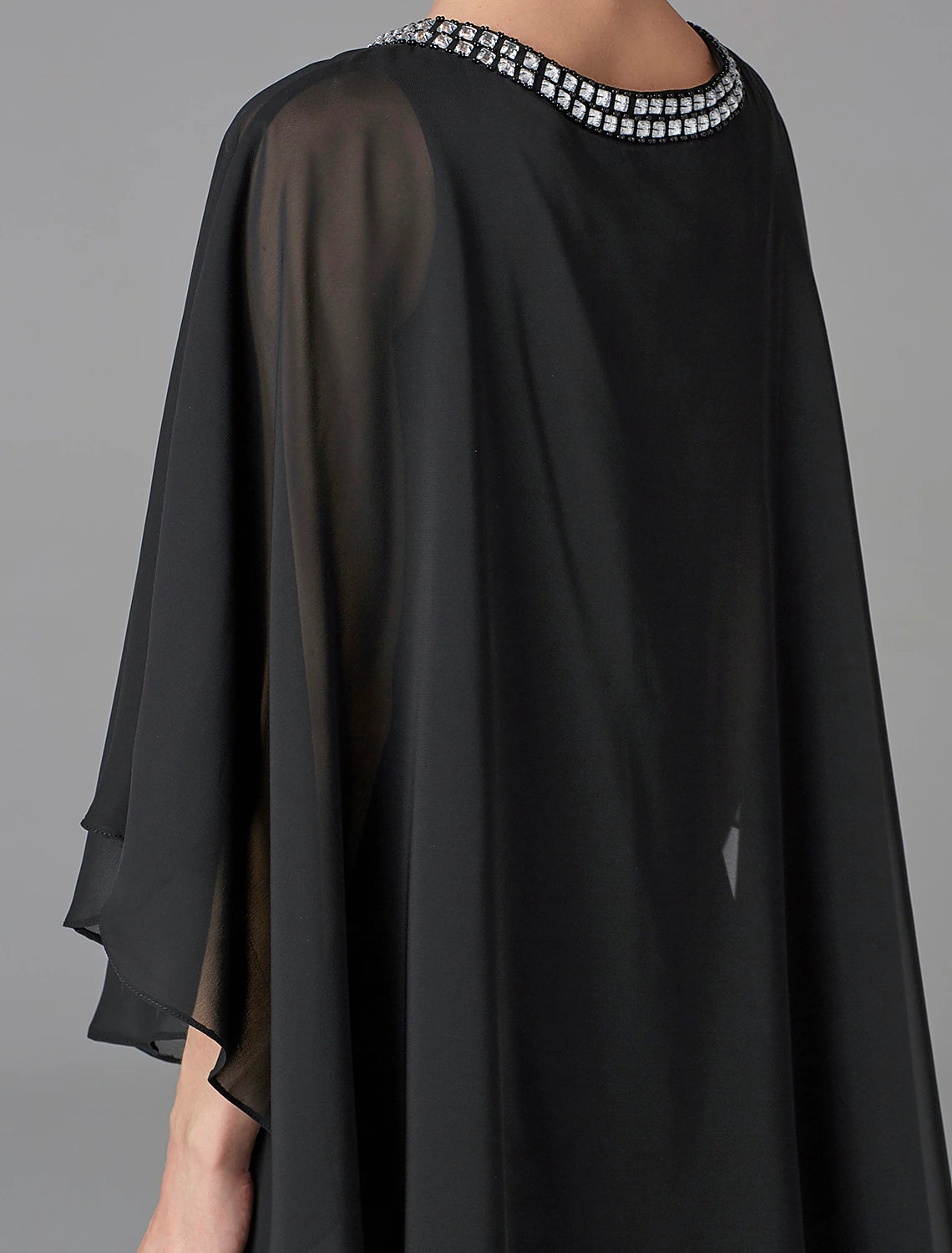 Woman posing in the plus size A-line gown, showcasing its flattering silhouette.