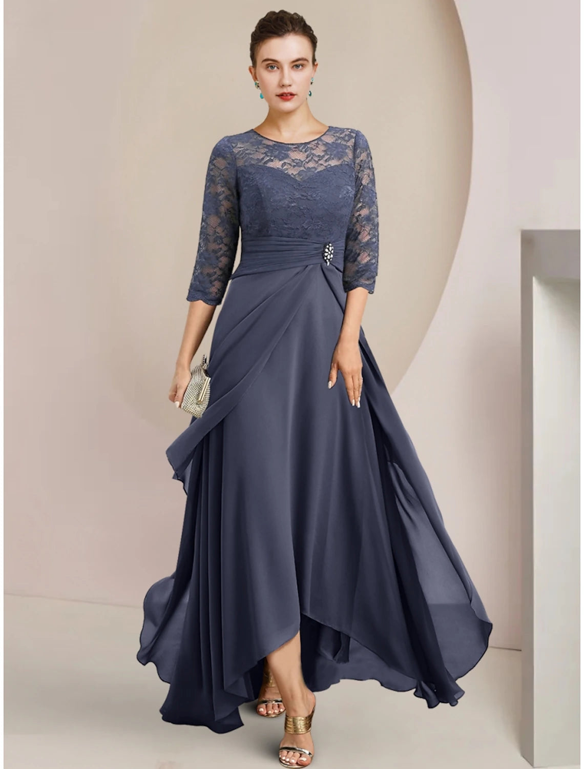 Elegant A-line chiffon mother of the bride dress with jewel neck and half sleeves.