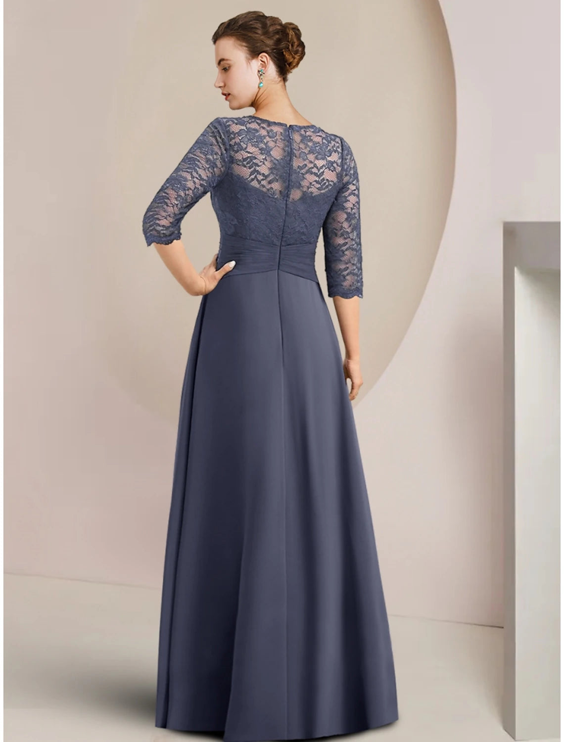 Back view of the A-line chiffon dress, showing asymmetrical hem and ruching.