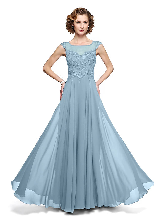 Close-up of the delicate lace appliques on the dress.