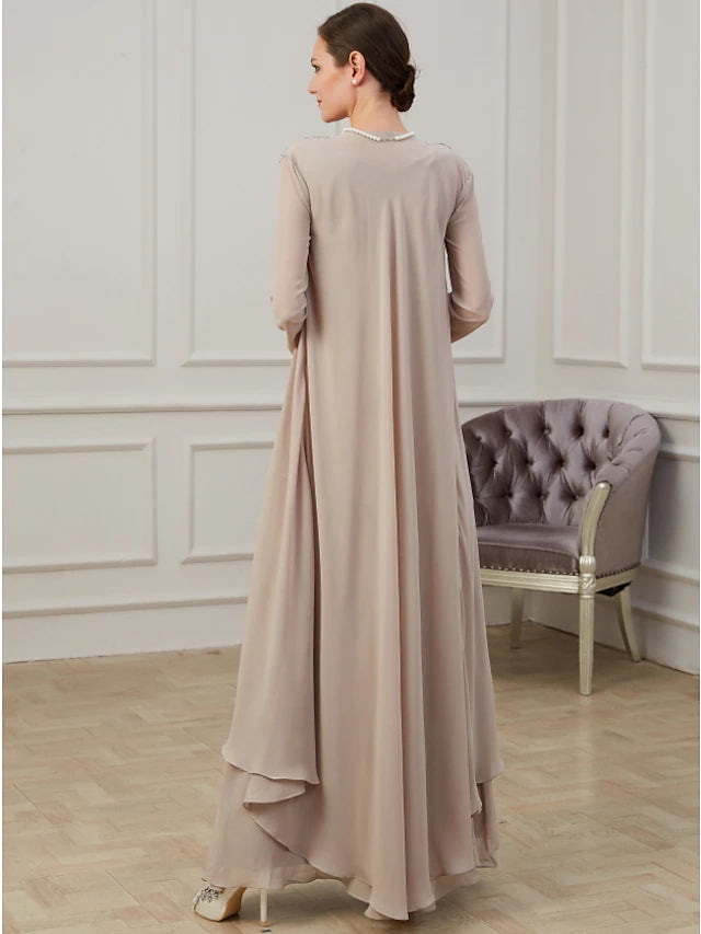 Mother of the Bride wearing the A-line floor-length dress with jacket, posing gracefully.