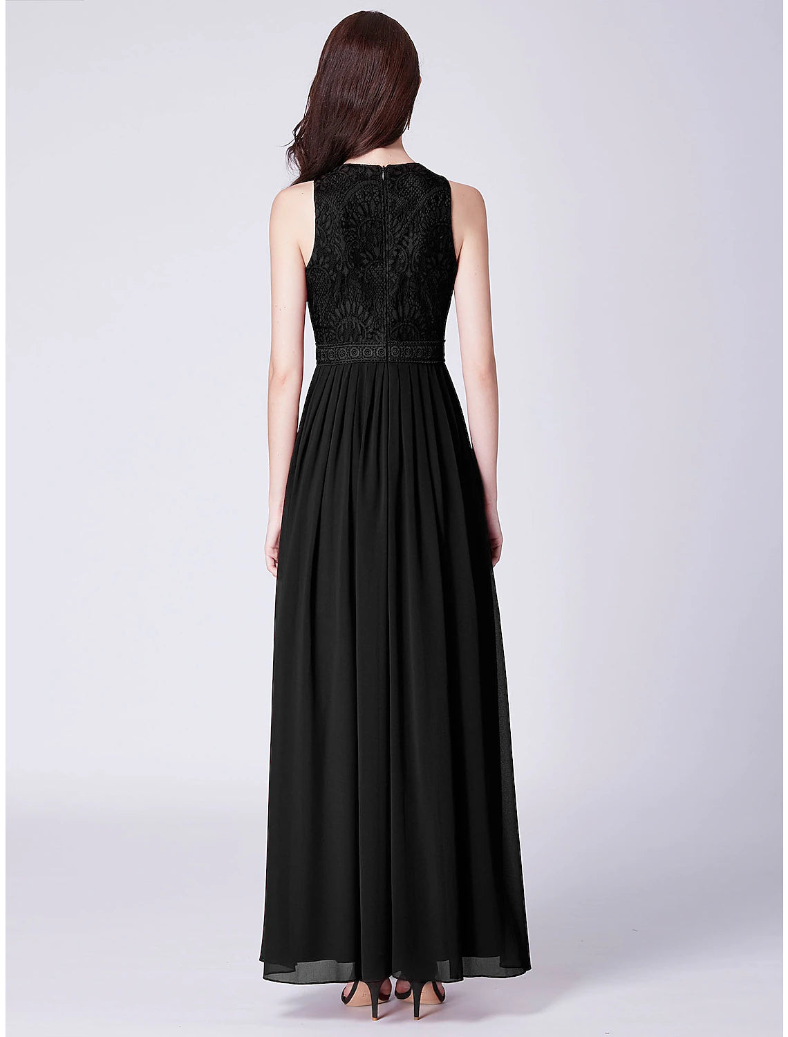 Close-up of the lace insert and pleats on the chiffon dress.
