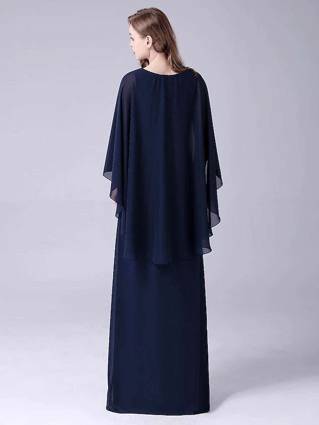 Close-up of the jewel neckline and crystal details on the elegant dress.
