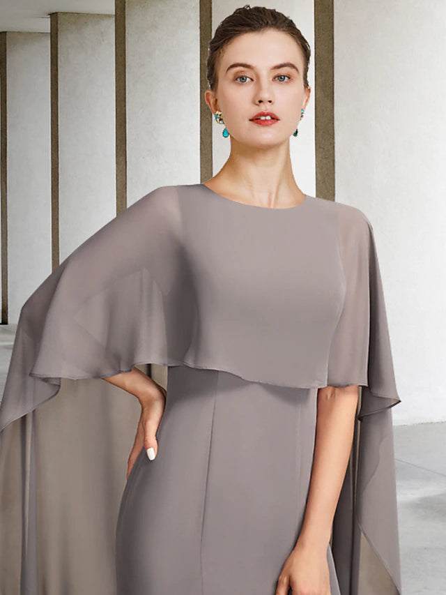 Back view of a plus size chiffon Mother of the Bride dress with a sweep train.