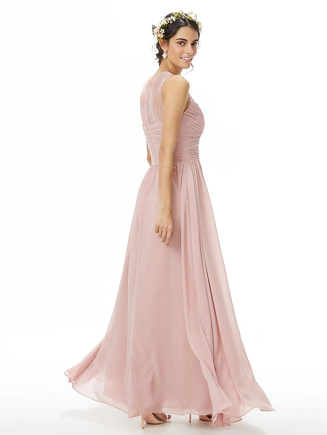 Bridesmaid dress showcasing criss-cross back details and flowing chiffon skirt.