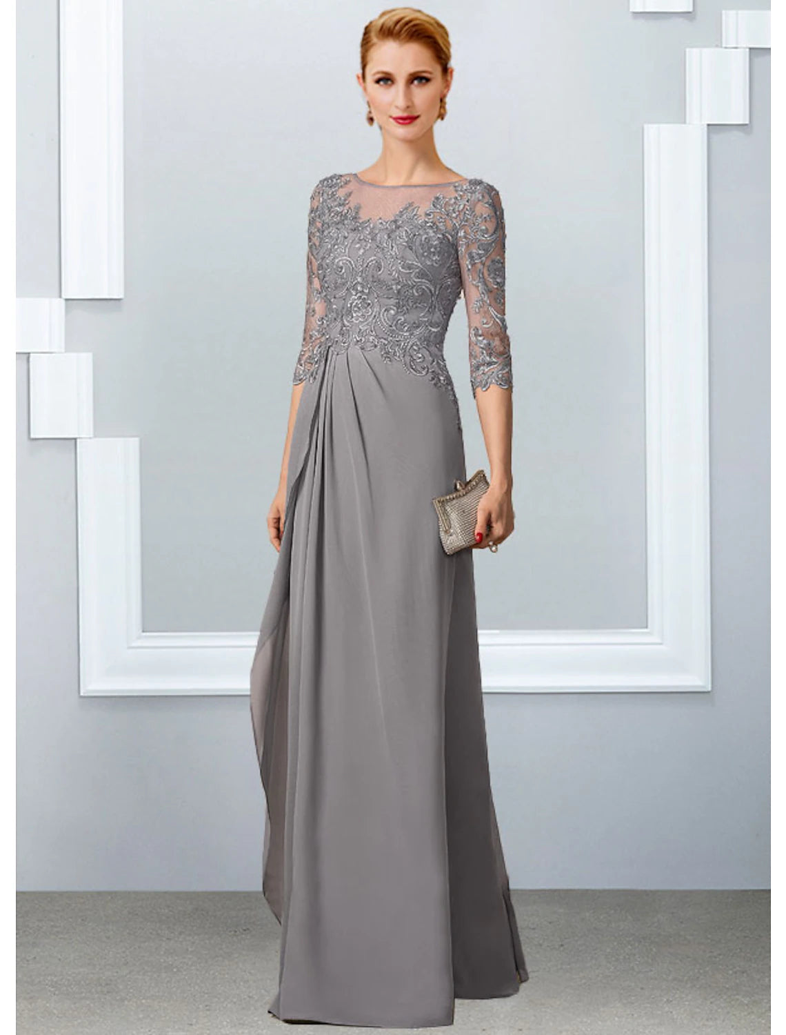 Elegant A-Line Mother of the Bride gown with jewel neck and half sleeves.
