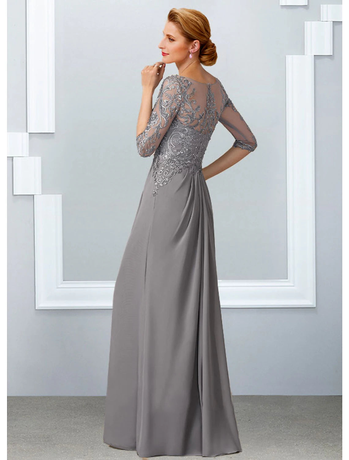 Close-up of chiffon lace and appliques on the bodice of the formal gown.