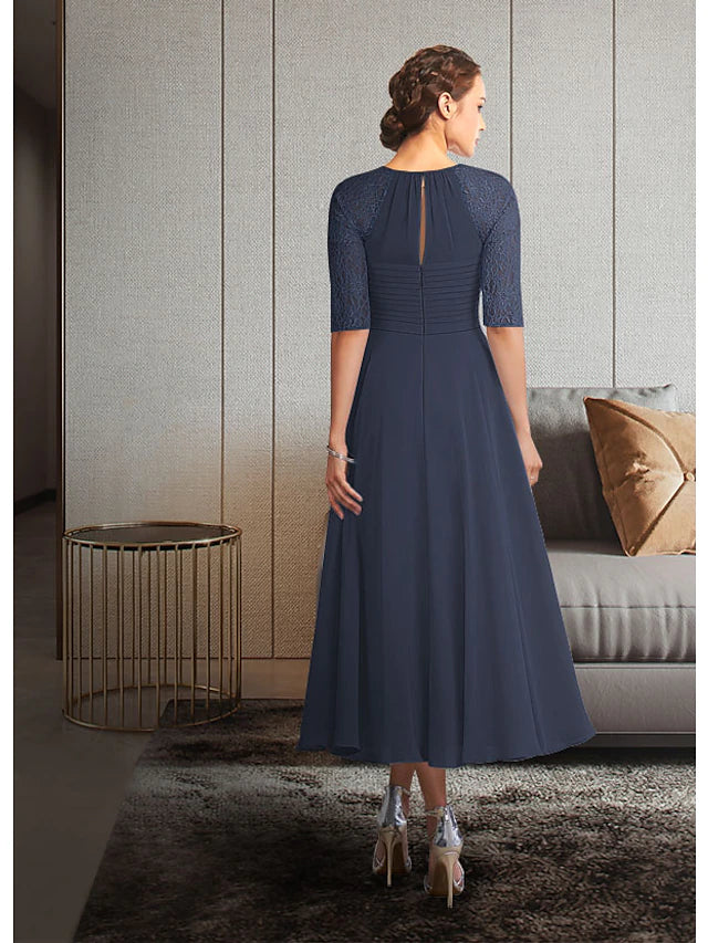 Tea length chiffon lace Mother of the Bride gown with pleated and ruched details.