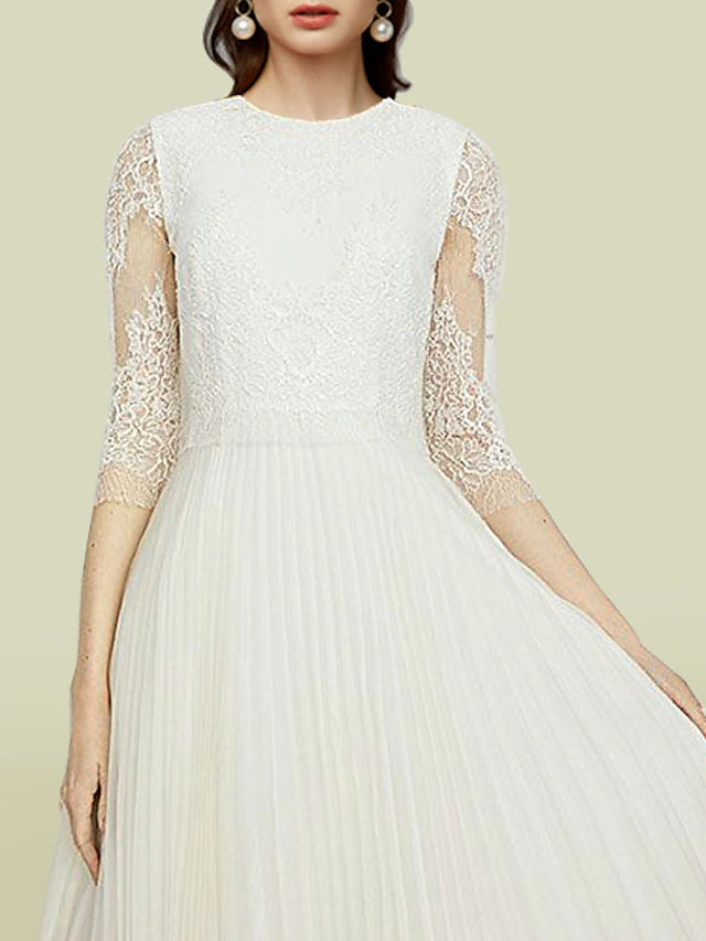 Close-up of the delicate lace and applique details on the A-Line dress.