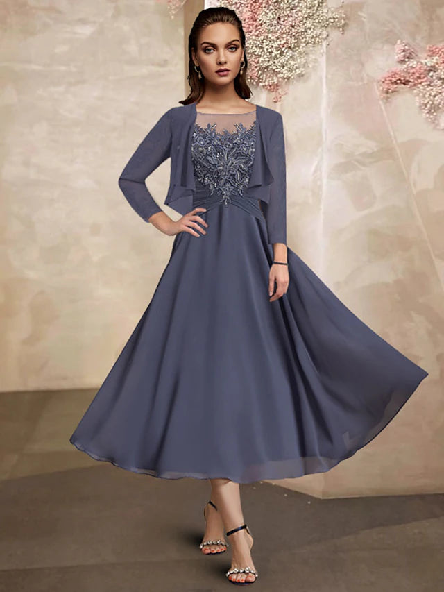 Elegant plus size A-line mother of the bride dress with jewel neck and half sleeves.