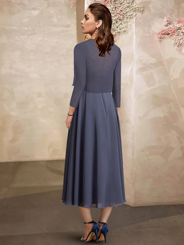Back view of the tea-length chiffon and lace dress, showing ruched details.