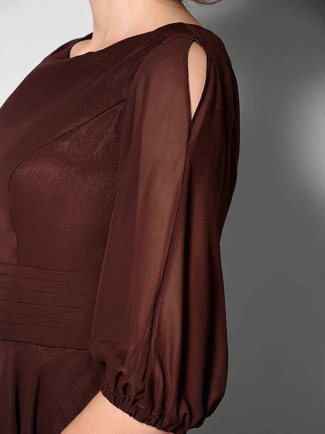 Full length view of the A-line chiffon dress with sash detail.