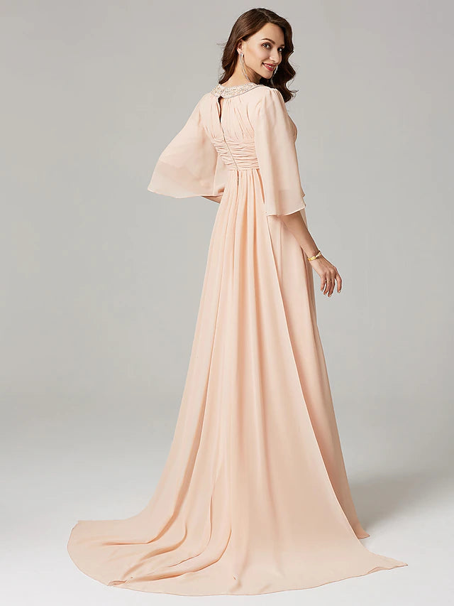 Side profile of a sophisticated A-Line dress featuring pleats and beading details.