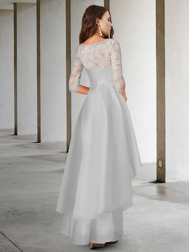 Close-up of the A-Line Mother of the Bride dress showing lace appliques and cascading ruffles.