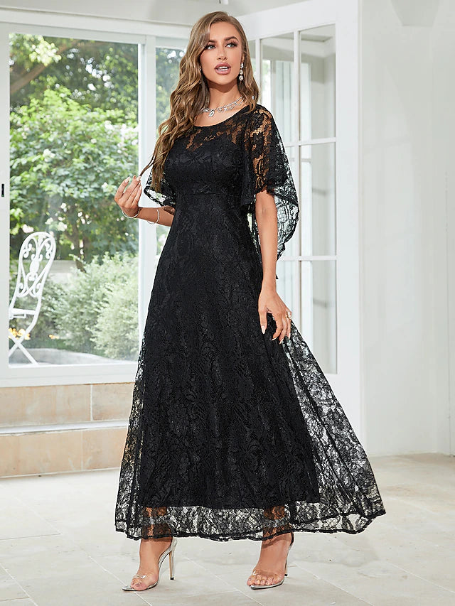 Side view of the A-line lace dress with ruffles and appliques.