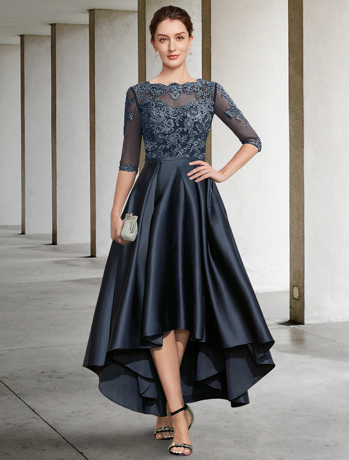 Elegant A-Line Mother of the Bride dress with jewel neck, half sleeves, and lace details.