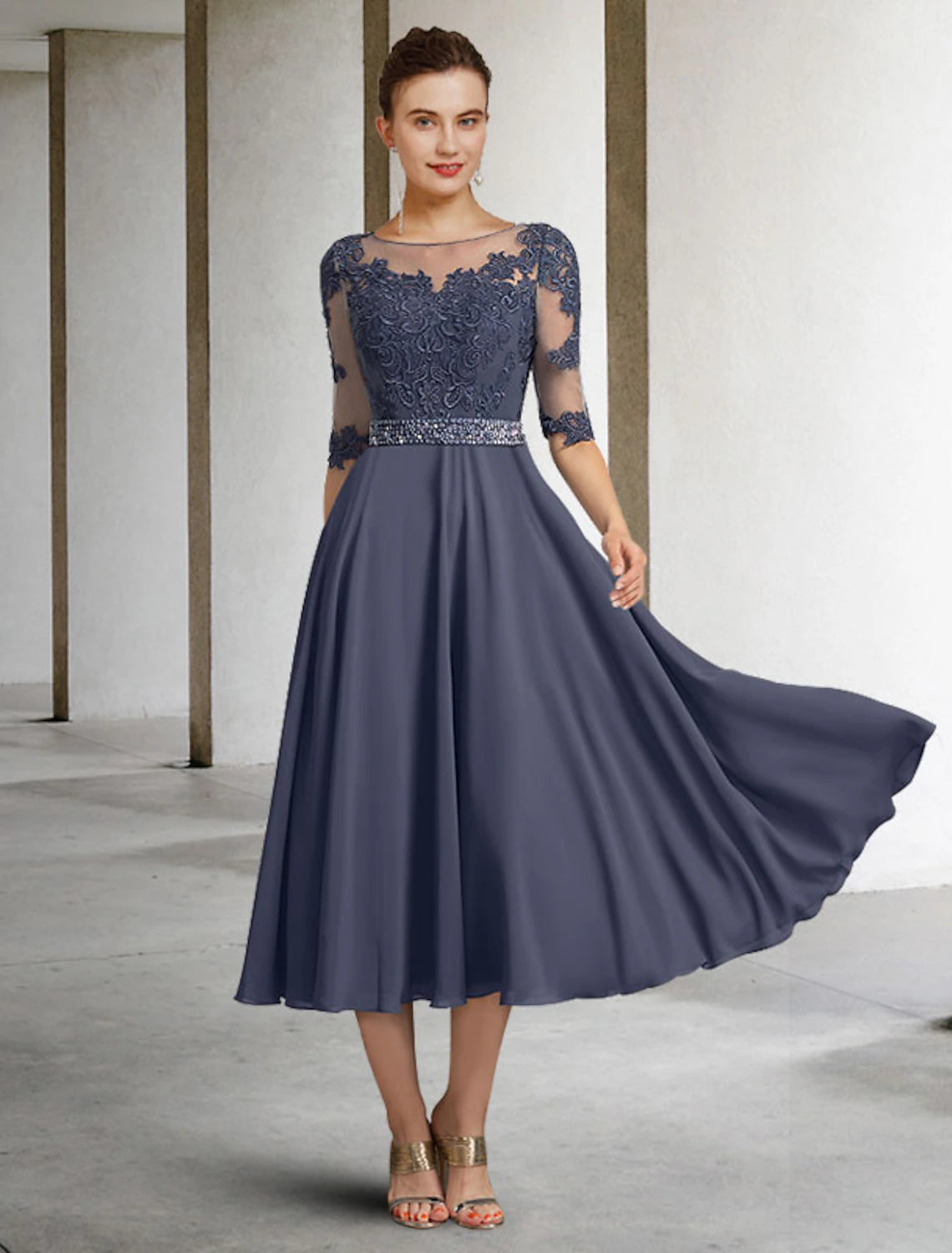 Elegant A-Line Mother of the Bride dress with jewel neck and half sleeves.