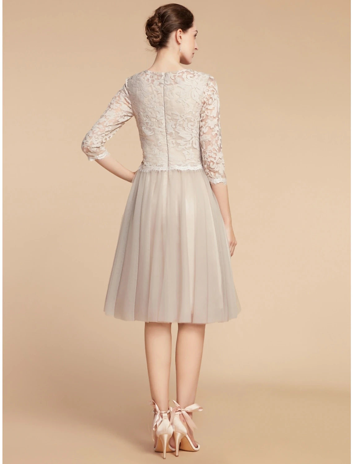 Close-up of the lace and tulle fabric on the dress bodice.