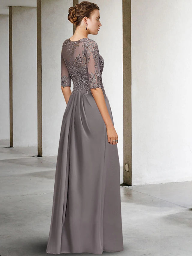 Close-up of the delicate lace and beading details on the dress.