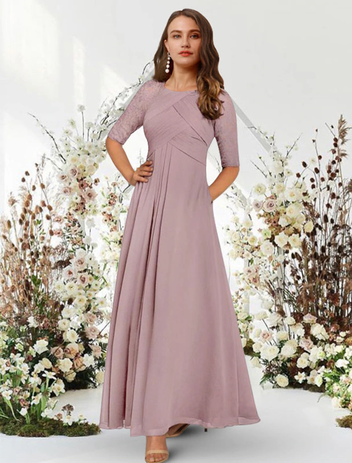 Elegant A-Line chiffon evening gown with jewel neck and half sleeves.