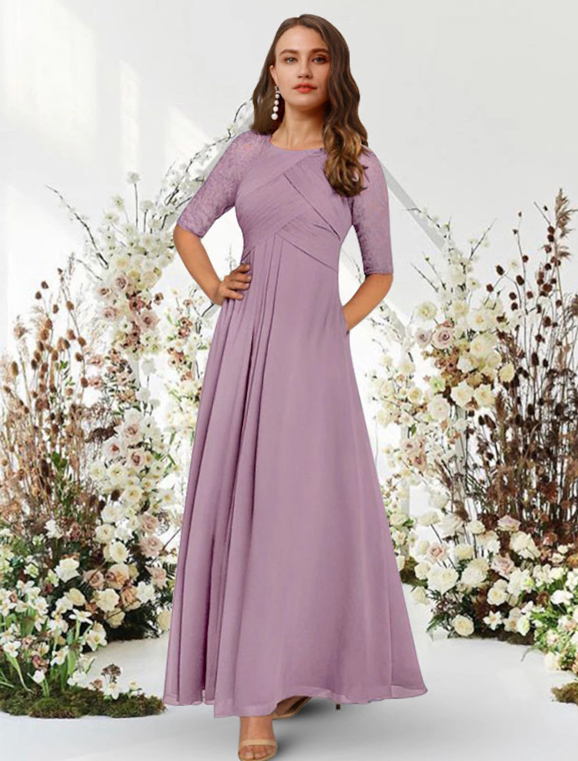 Close-up of jewel neck and half sleeve detail on chiffon gown.