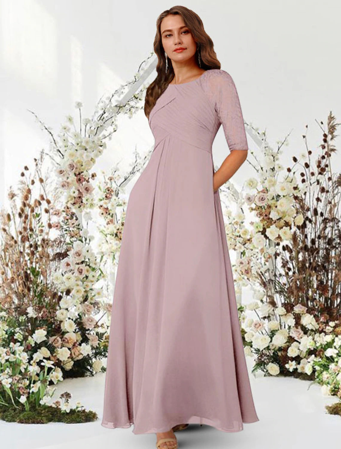 Model posing in A-Line evening gown with ruched details.