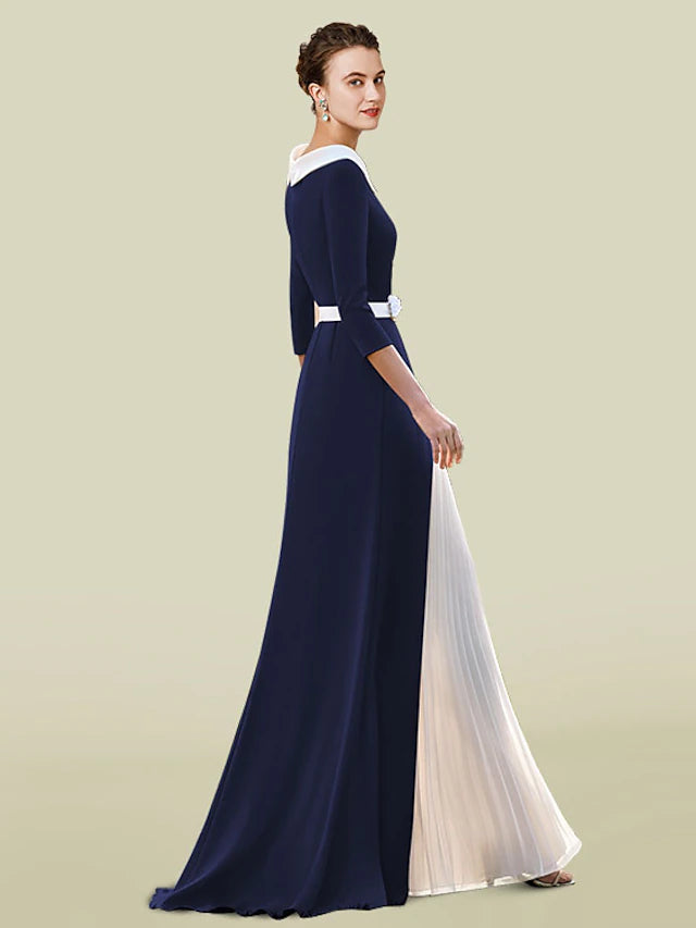 Floor-length pleated chiffon Mother of the Bride dress with sash detail.