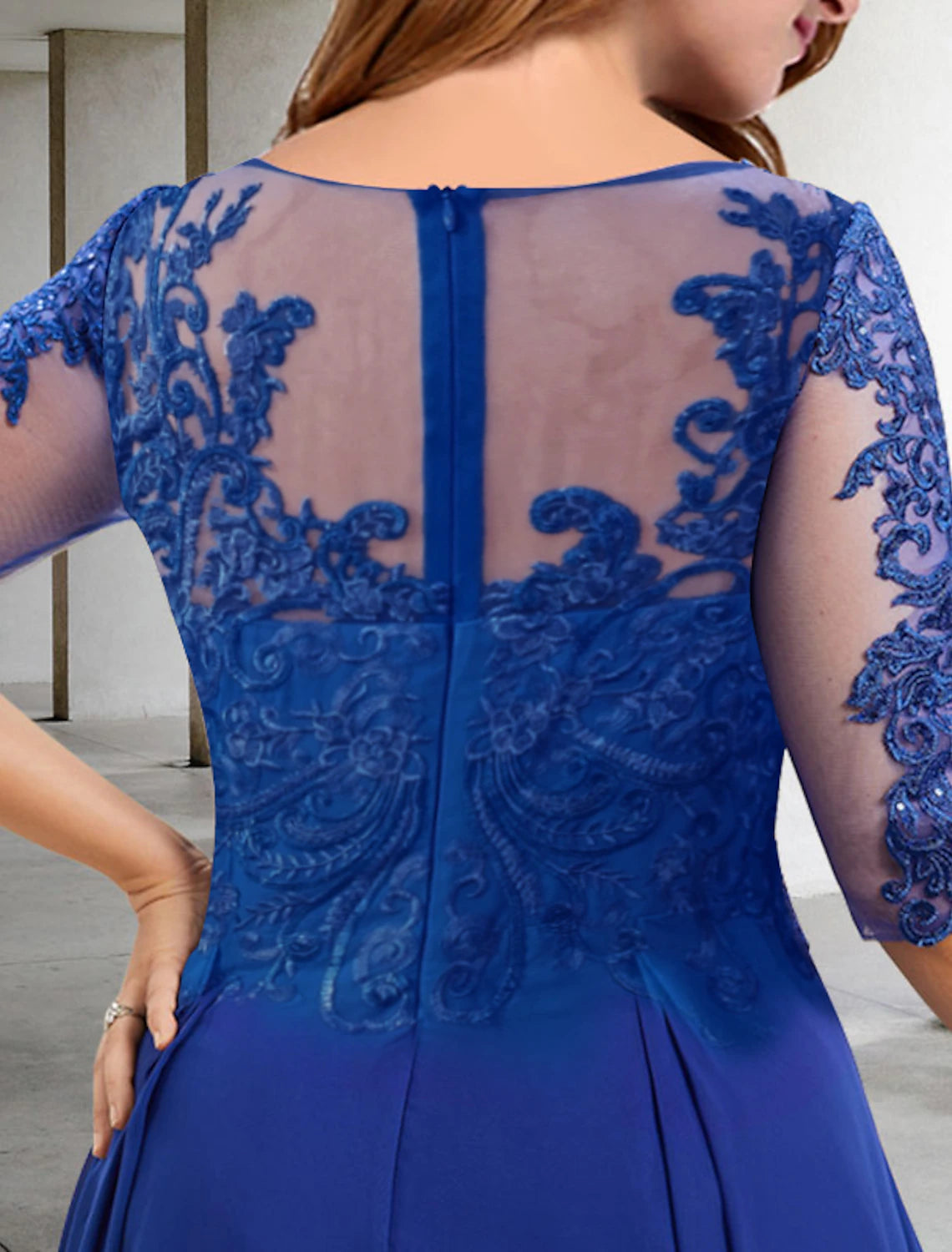 Close-up of the jewel neck and delicate sequin details on the elegant dress.
