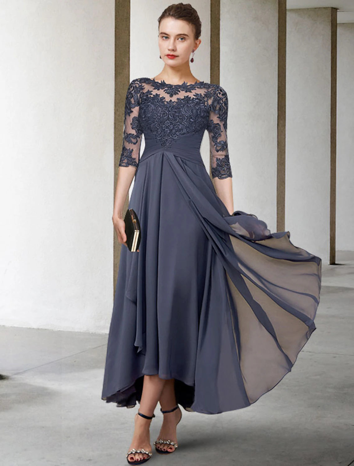 Elegant A-line Mother of the Bride dress with jewel neck and half sleeves.