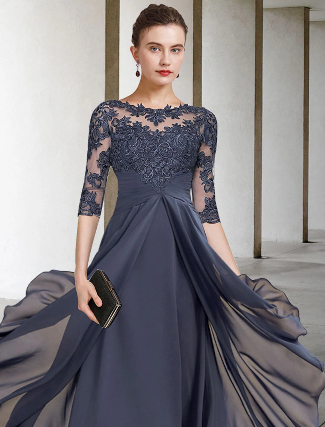 Plus size tea length dress featuring high-low asymmetrical hem and lace details.