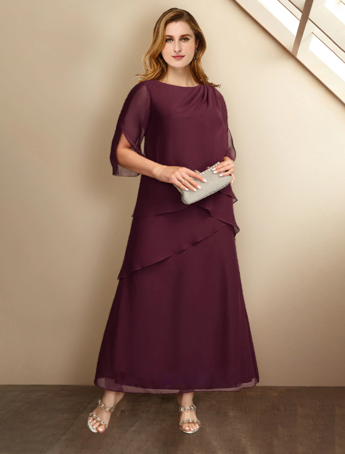 Elegant A-line Mother of the Bride dress with jewel neck and half sleeves.