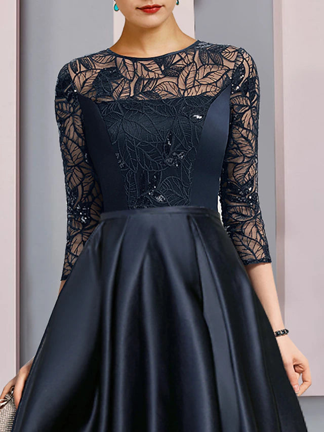 Side profile of the elegant A-line dress with flowing satin skirt.