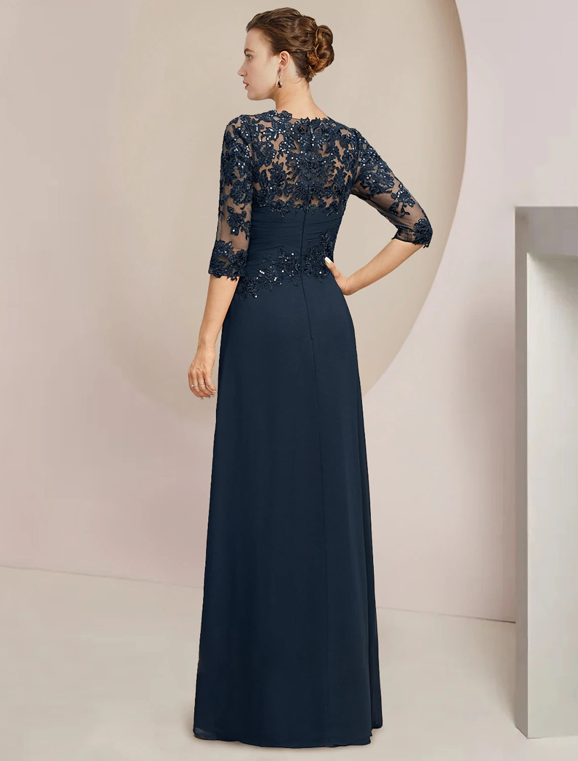 Elegant A-Line jewel neck gown with half sleeves and sequined lace details.