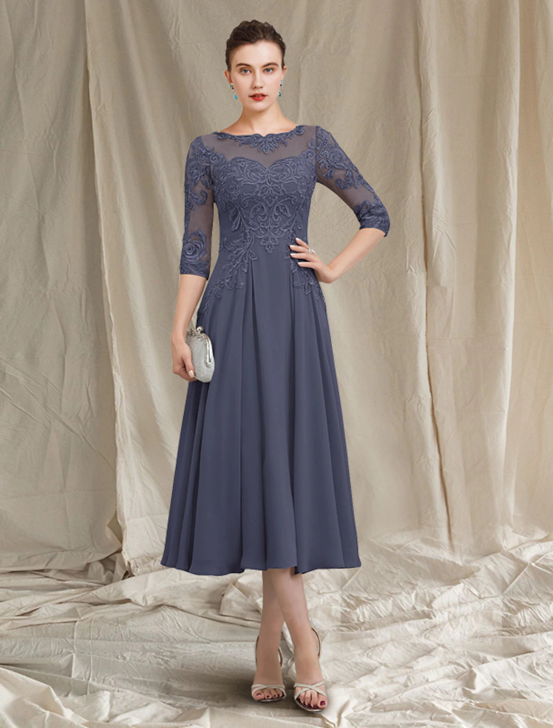 Elegant A-Line Mother of the Bride dress, jewel neck, half sleeves, tea length.
