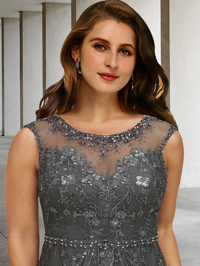 Close-up of intricate lace, beading, and sequin appliques on the dress.