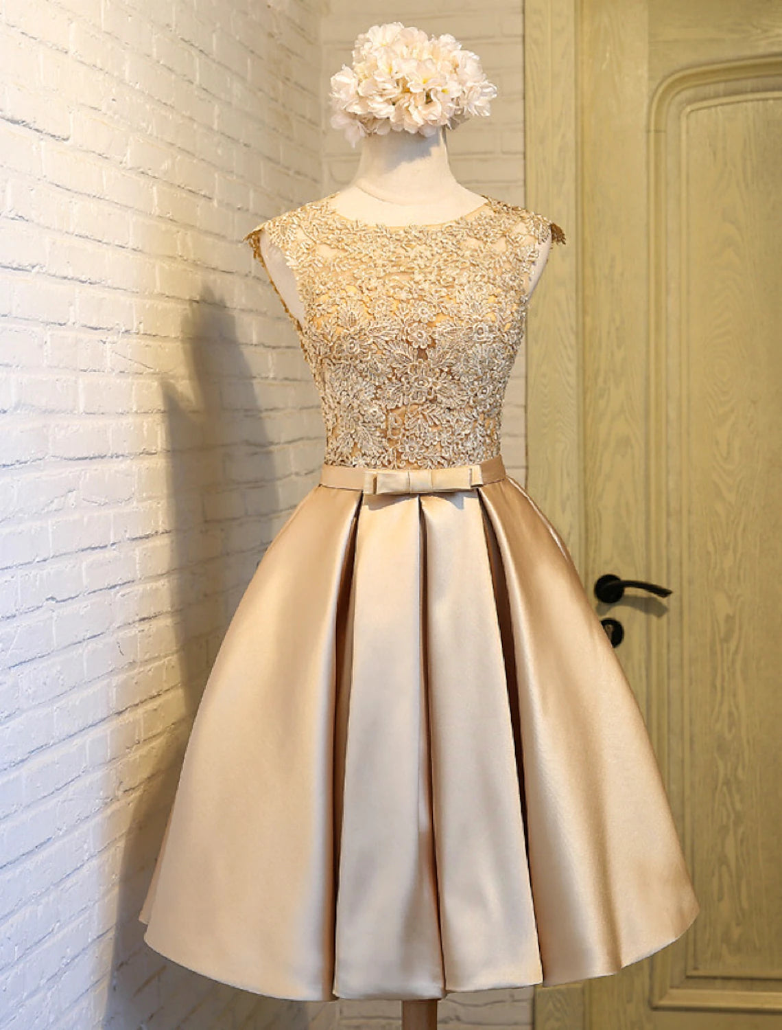 Back view of A-Line satin dress showing open back and butterfly detail.