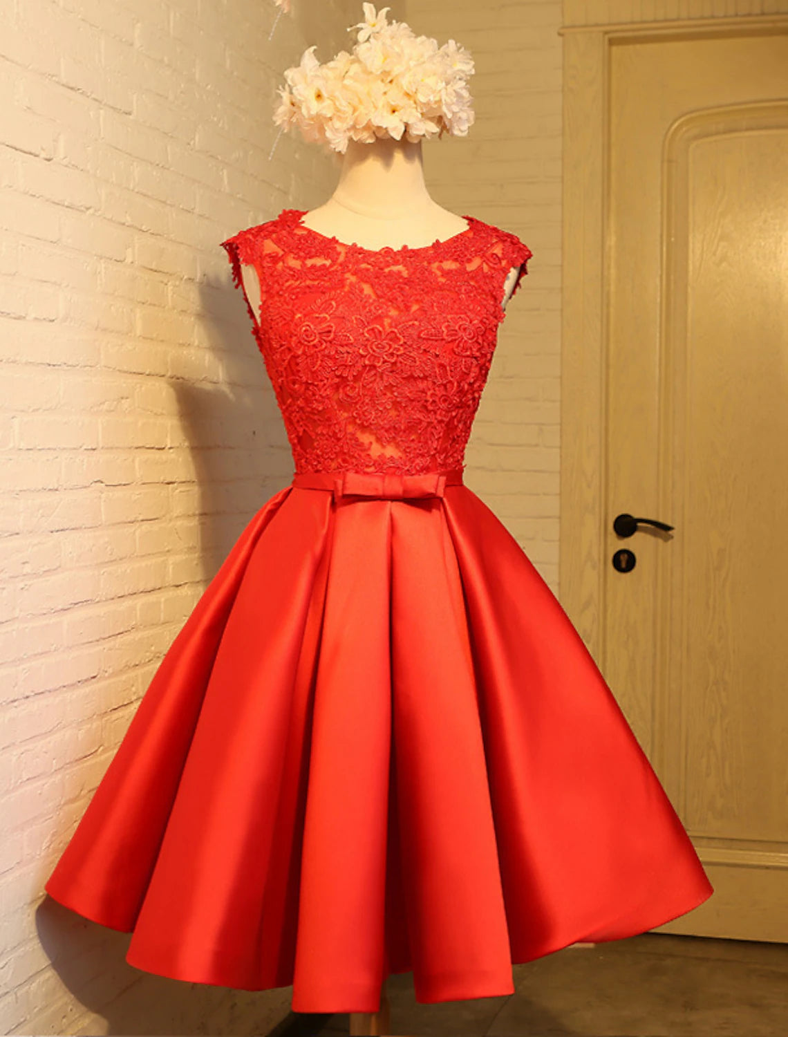 Full view of A-Line prom dress with satin skirt and lace top.